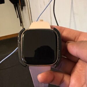 Fitbit Smartwatch with Black and Tan Case